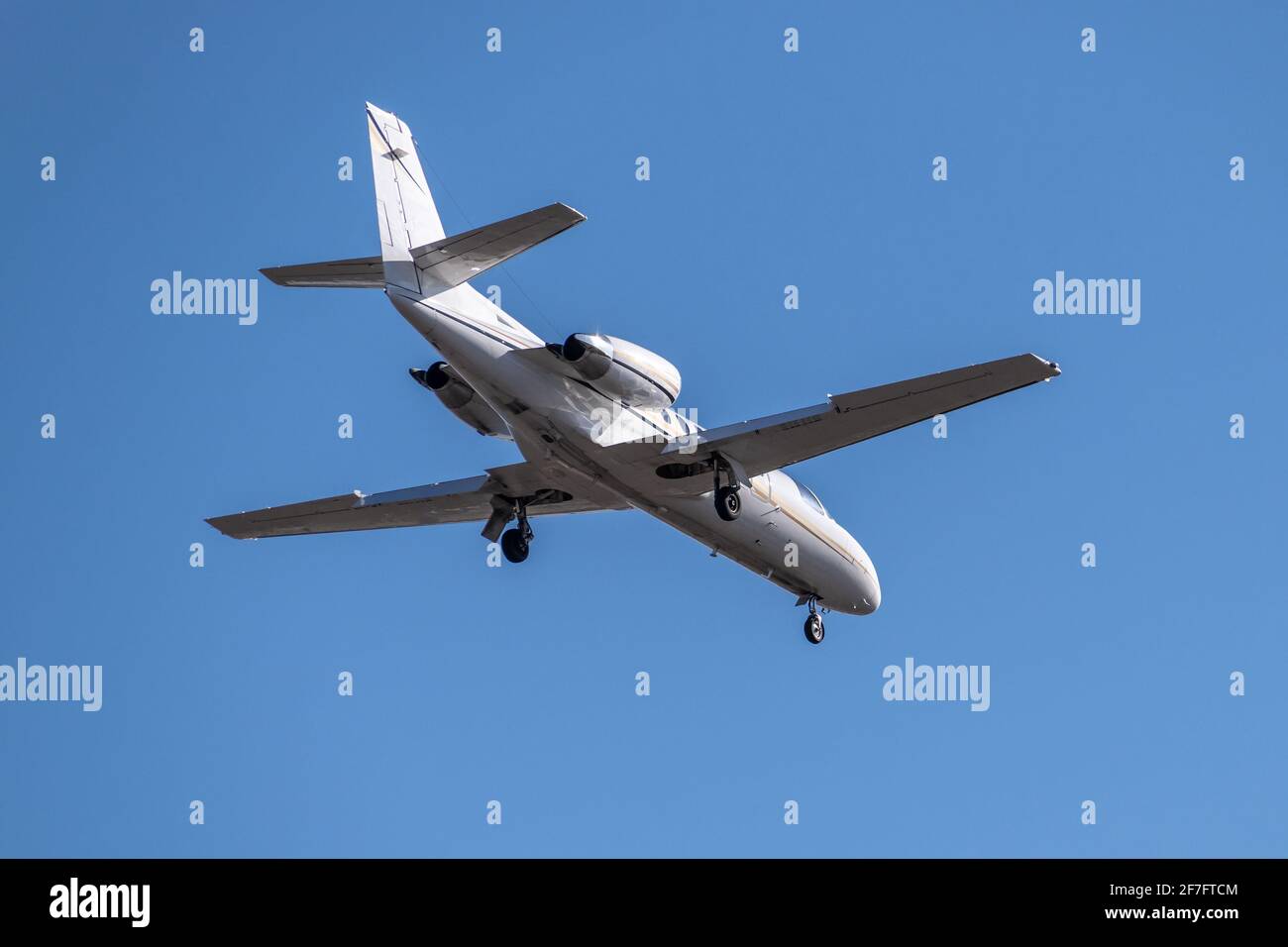 Business jet landing at the airport Stock Photo