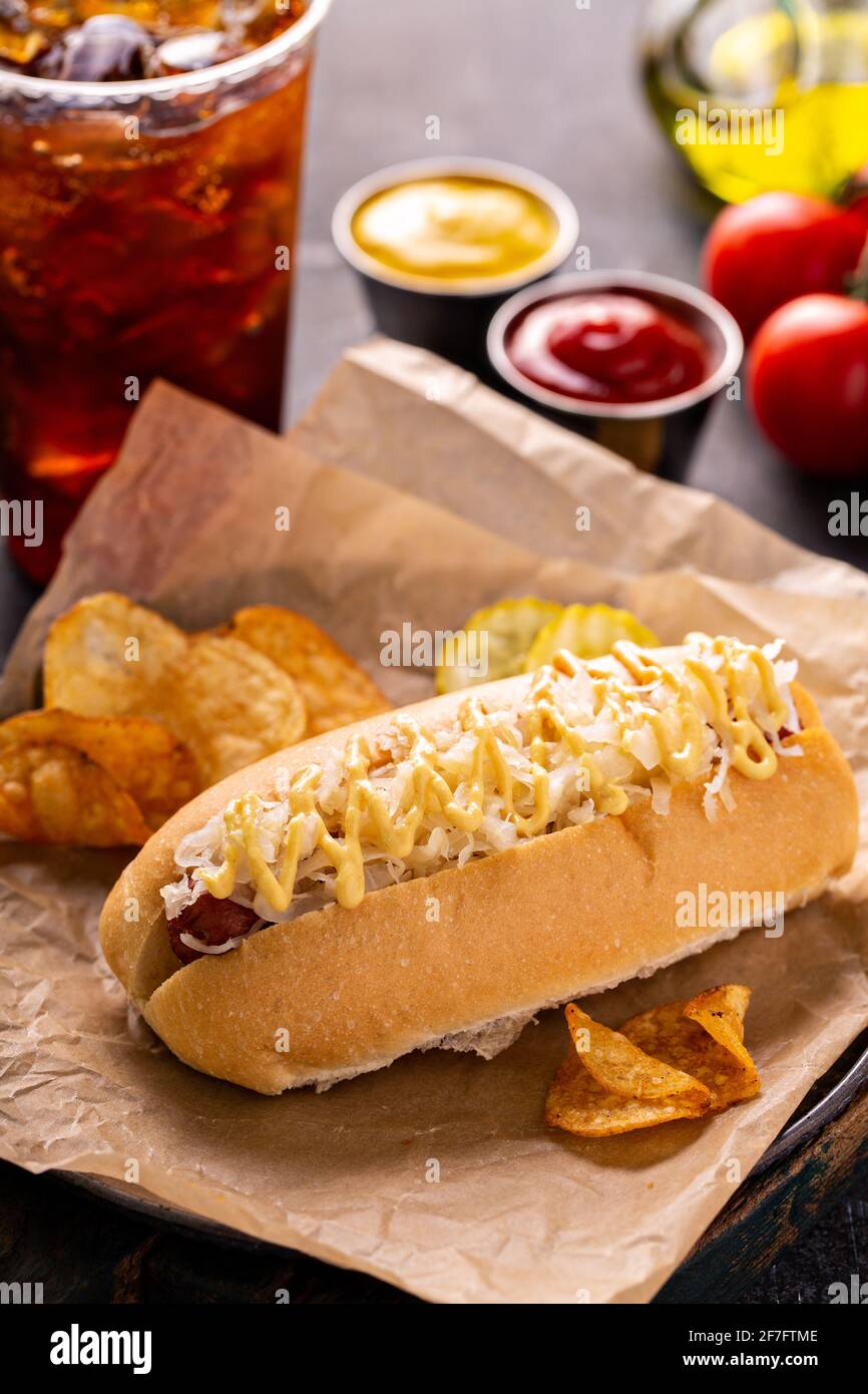 Hot dog with sauerkraut and mustard on parchment Stock Photo Alamy