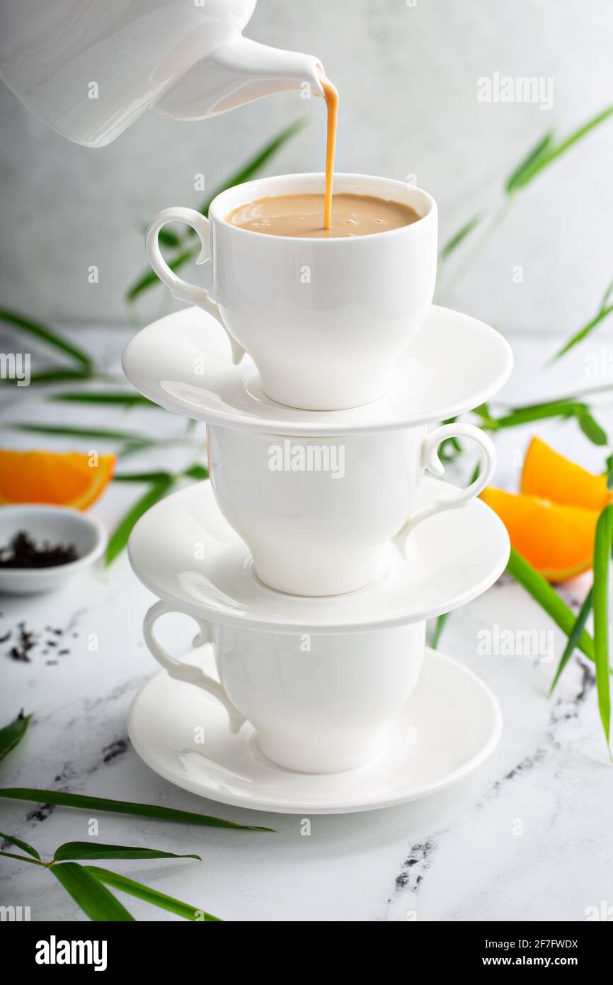 https://c8.alamy.com/comp/2F7FWDX/earl-grey-milk-tea-poured-in-stacked-cups-2F7FWDX.jpg