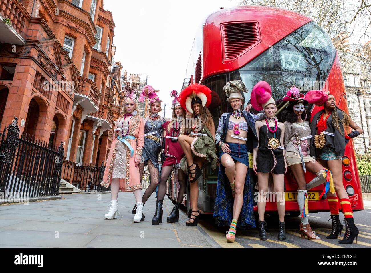Models showcase Pierre Garroudi's collection during the designer's flash mob fashion show at Sloane Square in London, UK Stock Photo