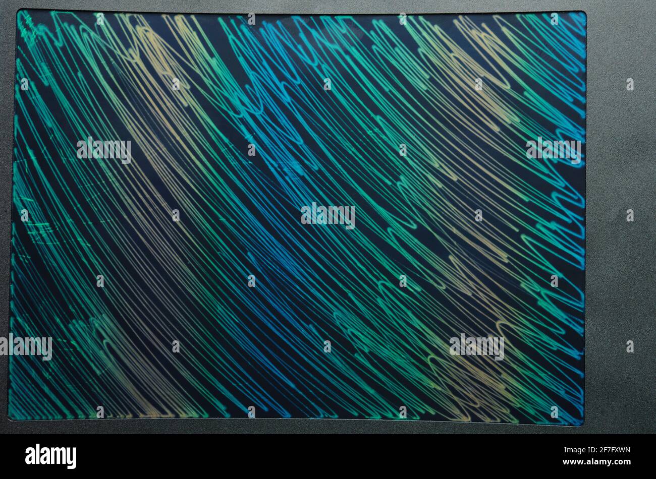 Colorful lines and curves on tablet screen flat layout frame Stock