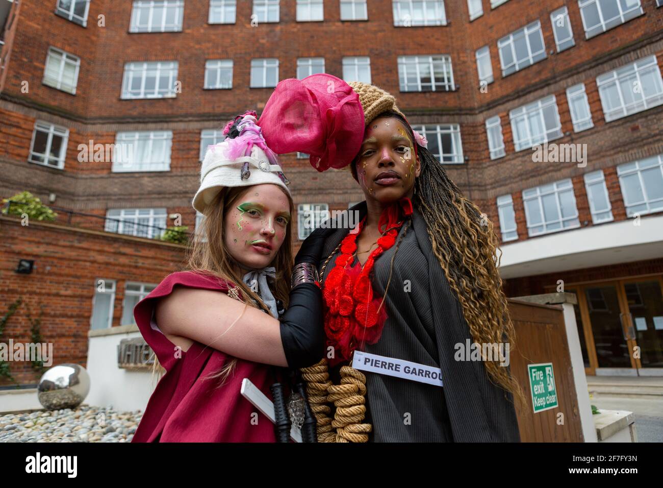 Models showcase Pierre Garroudi's collection during the designer's flash mob fashion show at Sloane Square in London, UK Stock Photo