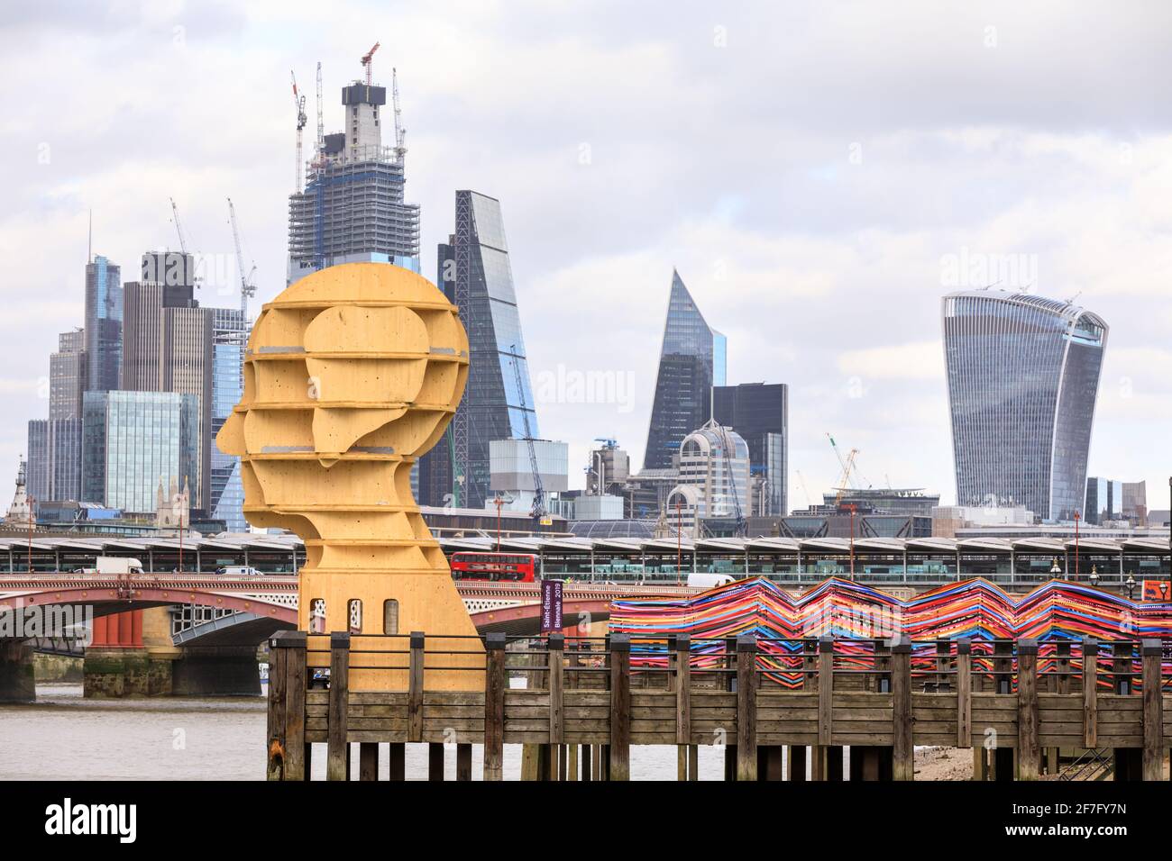 'Head Above Water' wooden sculpture by Steuart Padwick, and François Dumas and Lisa White 'Gateway to Inclusion' installation at Oxo Tower, part of Lo Stock Photo