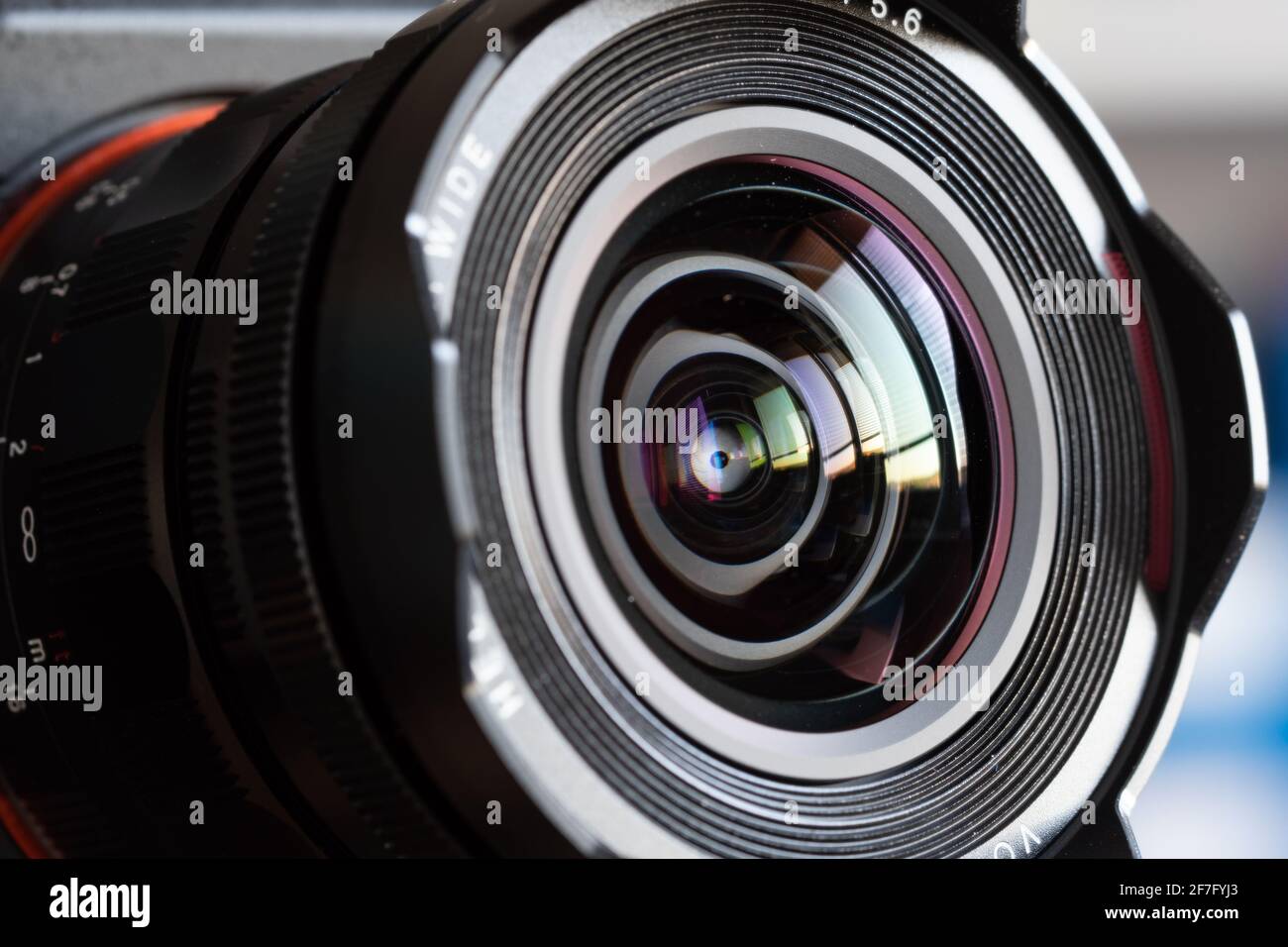Close-up camera lens with color reflections Stock Photo