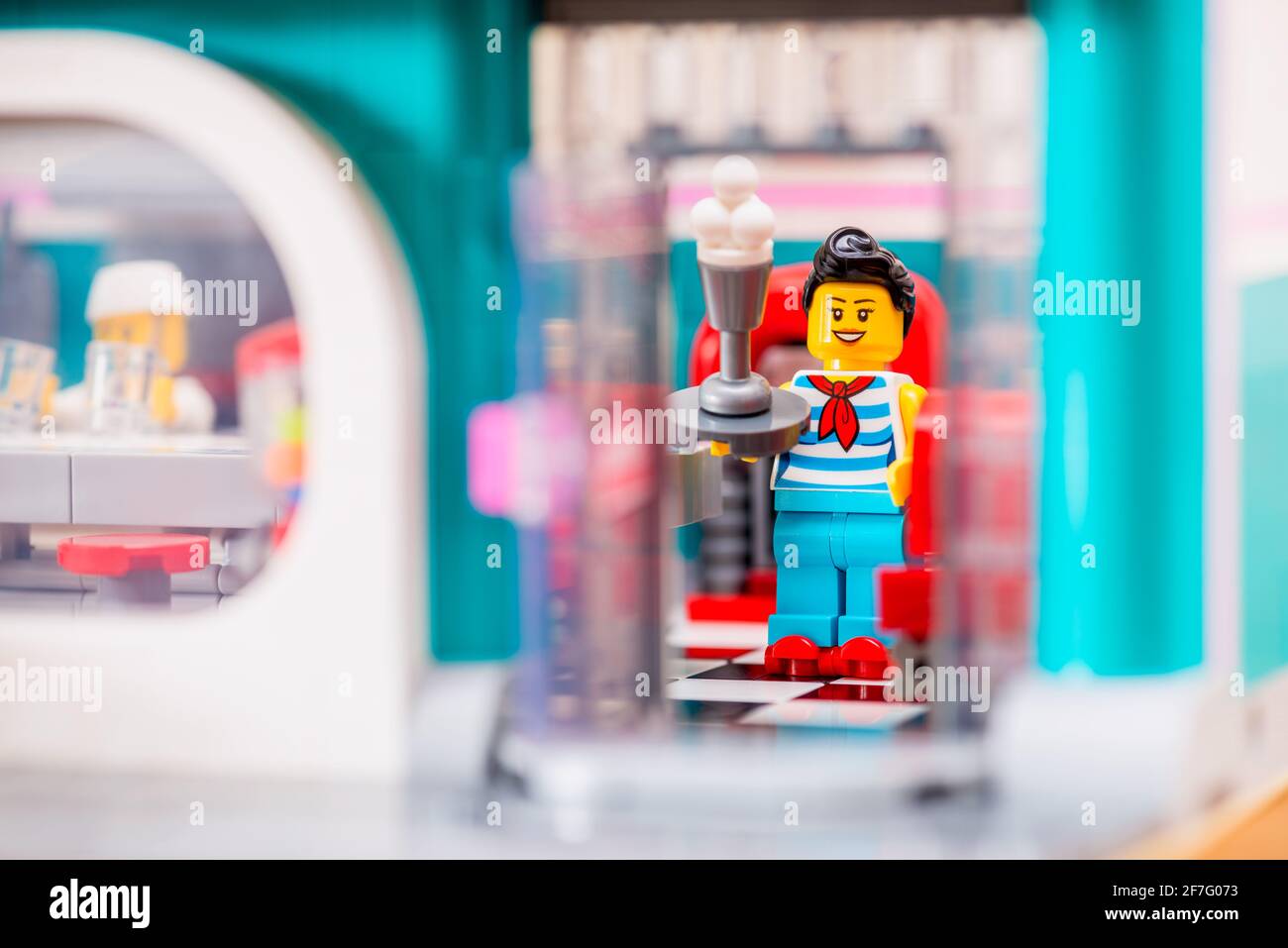 Lego Minifigure Waitress on Rollerskates serving Ice Cream in Old Fashioned Diner Stock Photo