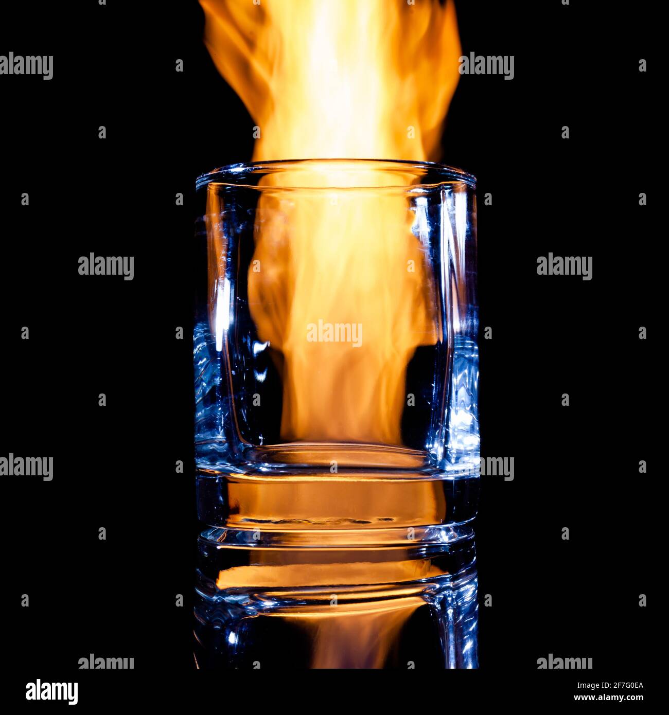 empty glass for strong alcohol on a black background Stock Photo