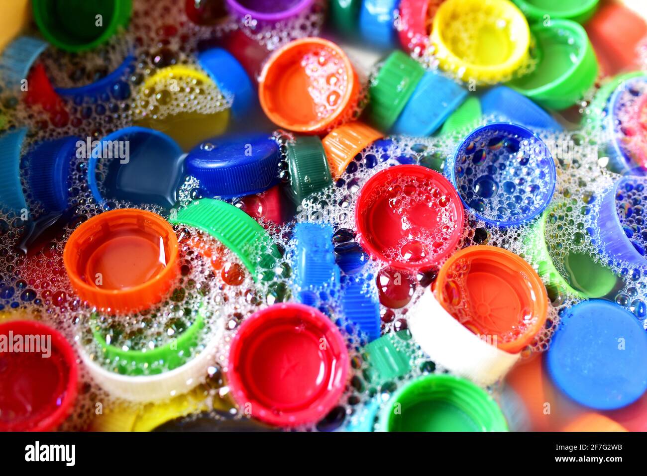 Recycling of plastic bottle caps. Cap material is recyclable.Remove