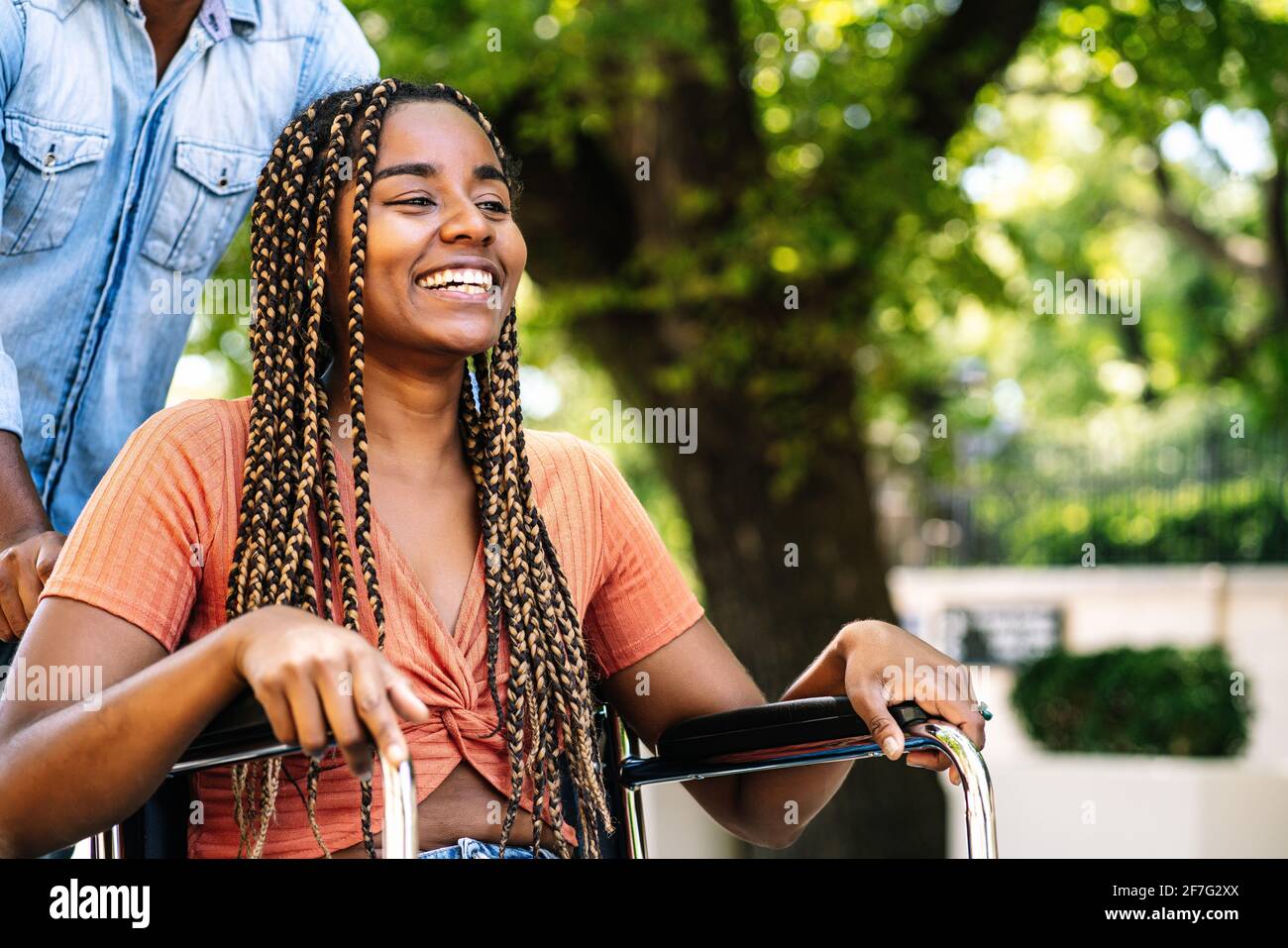 Woman in a wheelchair enjoying a walk with her boyfriend Stock Photo ...