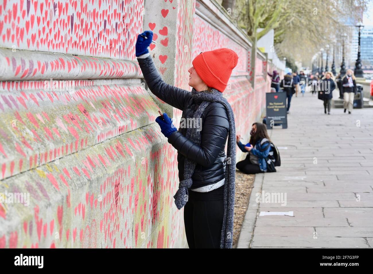 London. UK. Hearts continue to be added to the National Covid Memorial Wall at St. Thomas' Hospital Westminster, in memory of those who have died from coronavirus during the pandemic. Stock Photo