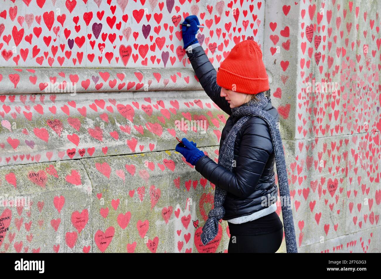 London. UK. Hearts continue to be added to the National Covid Memorial Wall at St. Thomas' Hospital Westminster, in memory of those who have died from coronavirus during the pandemic. Stock Photo