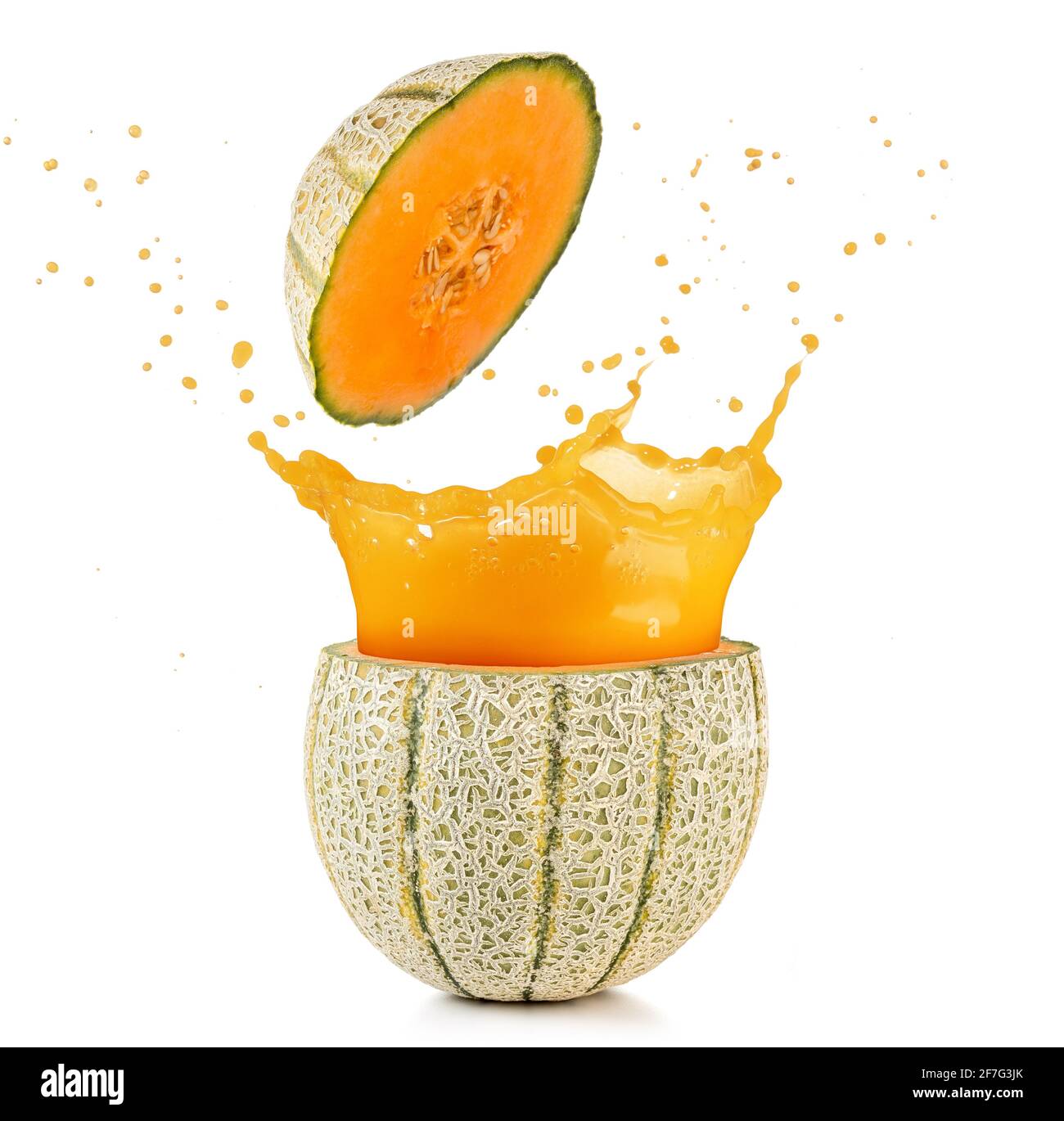 juice spilling out of a cantaloupe melon isolated on white Stock Photo
