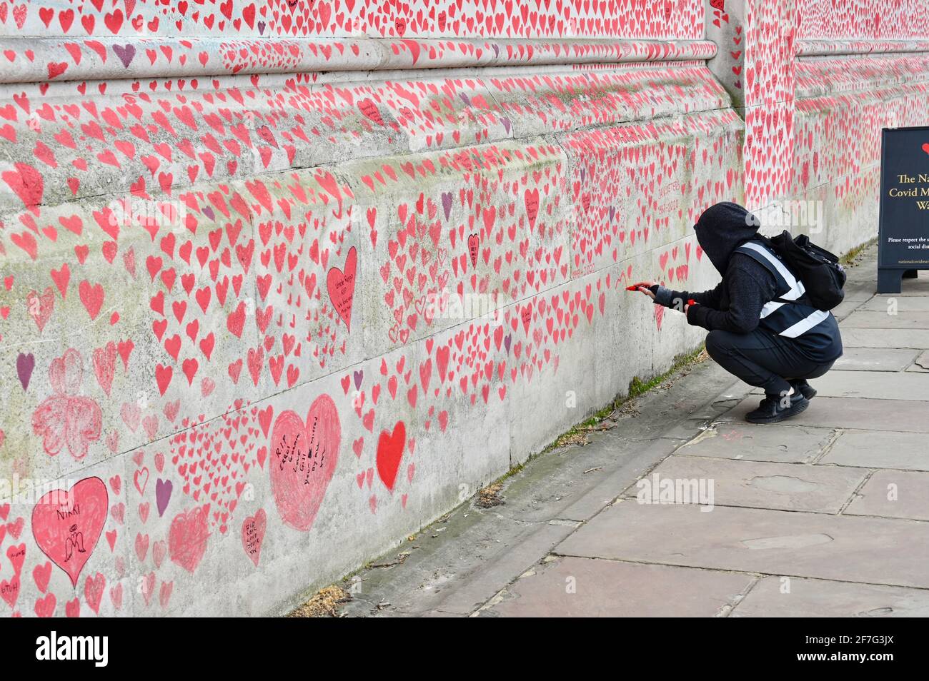 London. UK. Hearts continue to be added to the National Covid Memorial Wall at St. Thomas' Hospital Westminster, in memory of those who have died from coronavirus during the pandemic. Stock Photo