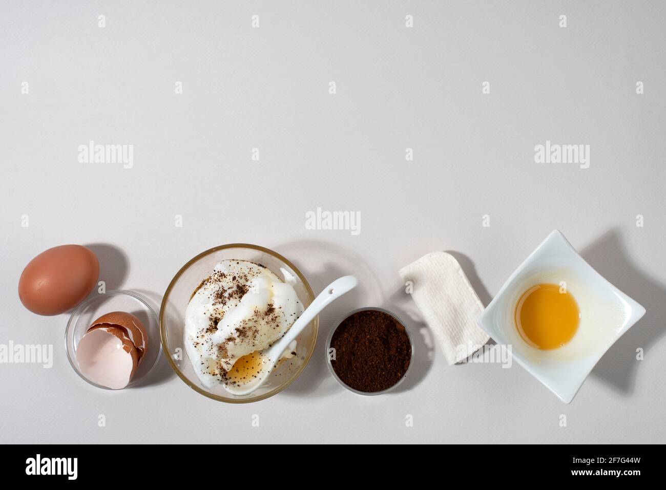 Egg White Face Mask ingredients. Whipped egg white, honey, coffee grounds.  Top view. Banner Stock Photo - Alamy