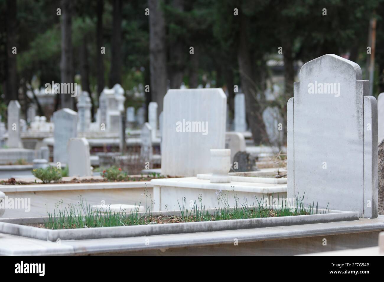 Grave with headstone at Muslim cemetery. Graves background Stock Photo