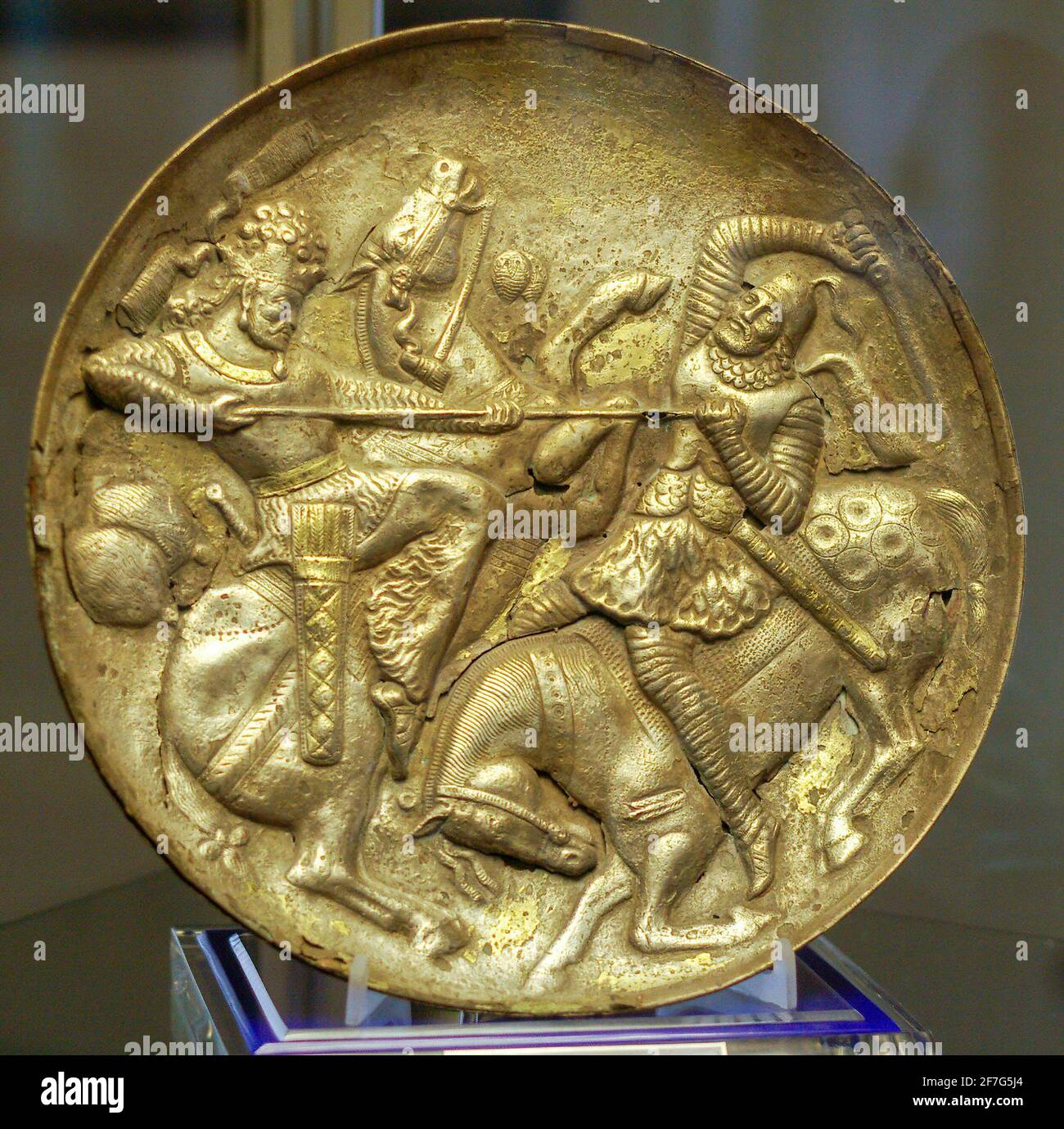 Sasanian gold-plated silver dish depicting the King fighting an opponent, Tabriz Museum, Iran. Stock Photo