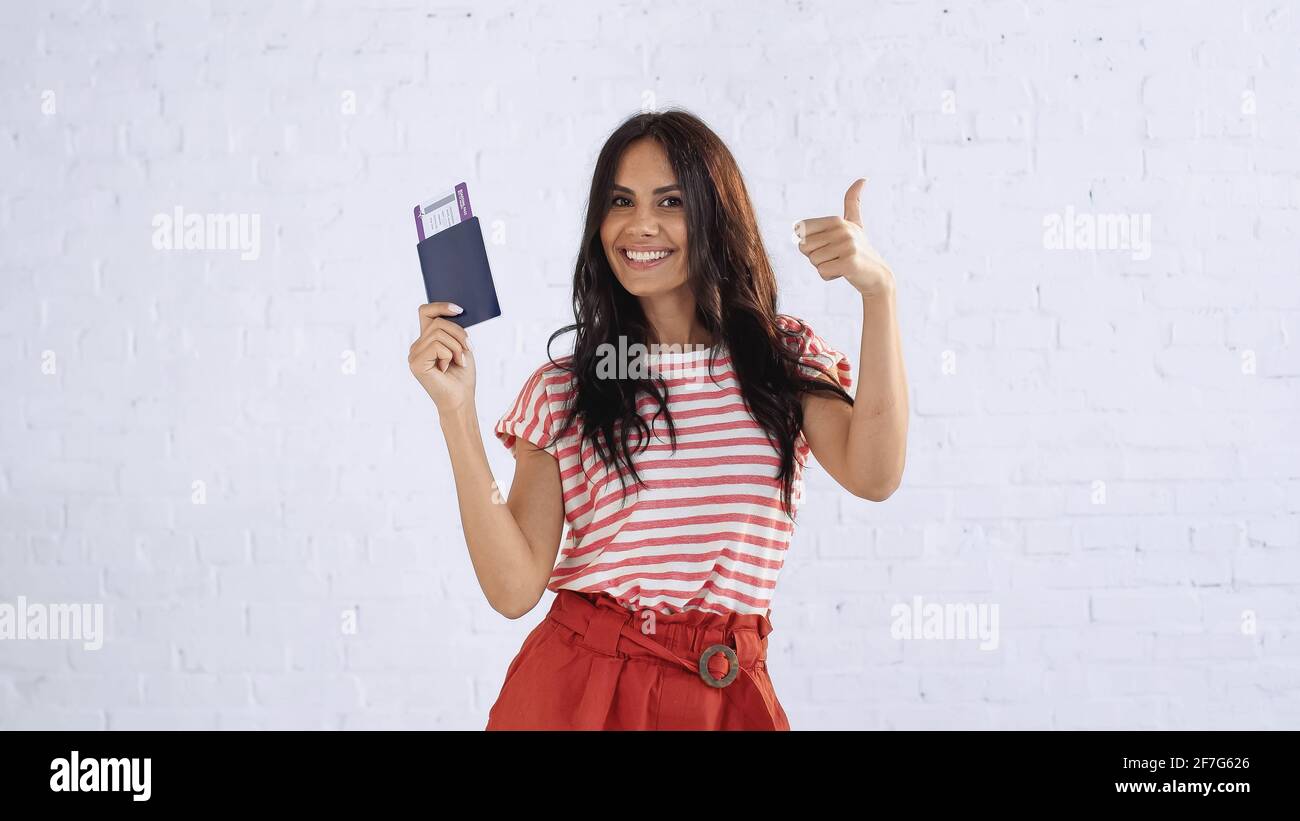 Happy tourist woman thumb hi-res stock photography and images - Alamy