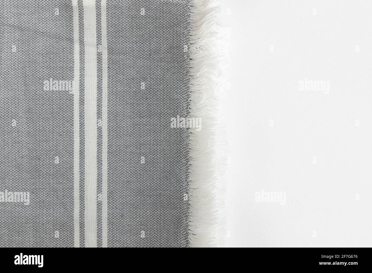 Folded grey cotton napkin isolated on white background with copy space. Top view Stock Photo