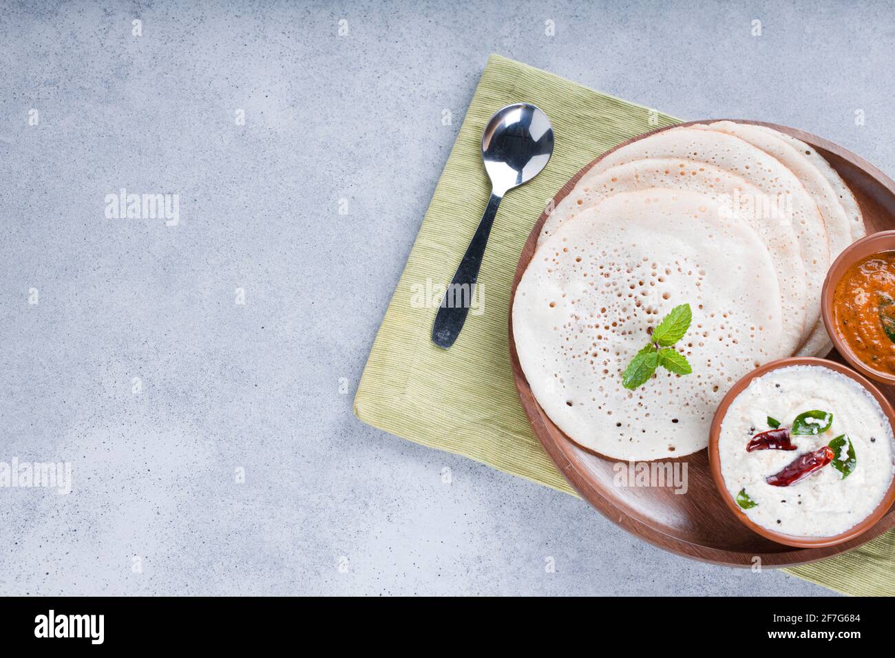 South Indian traditional breakfast Dosa or Thattu dosa made using cast