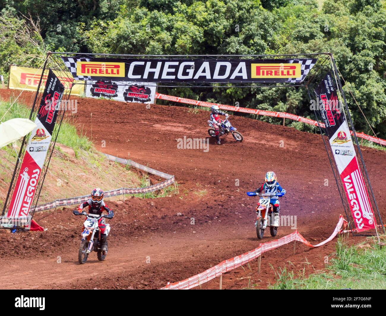 Kids racing on a motocross racing Stock Photo - Alamy