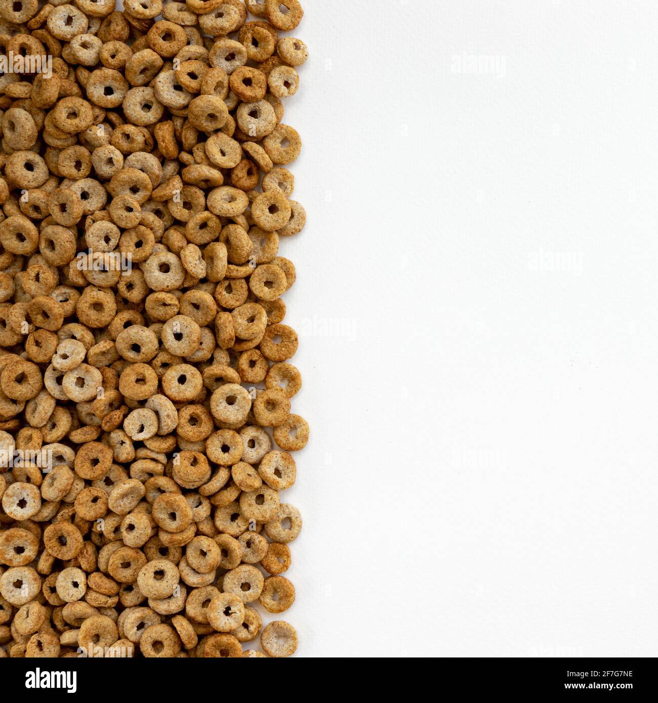 delicious cheerios oat cereal in large pile, cereal cheerios background, delicious and useful breakfast, frame with rings breakfast cereal Stock Photo