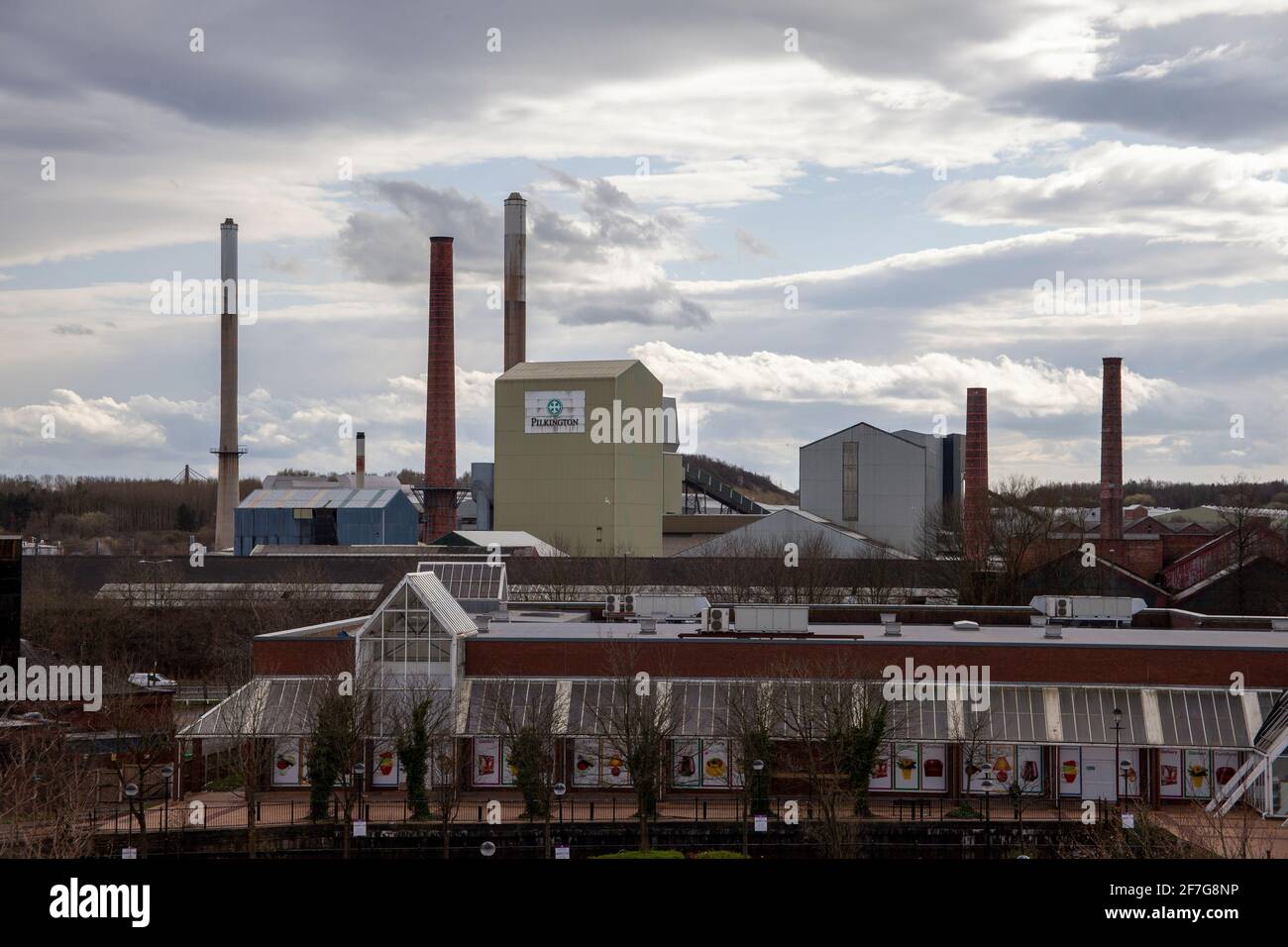 Pilkington Glass (Greengate Works) factory in St Helens, UK, with 'The Range' retailer in the foreground. Stock Photo