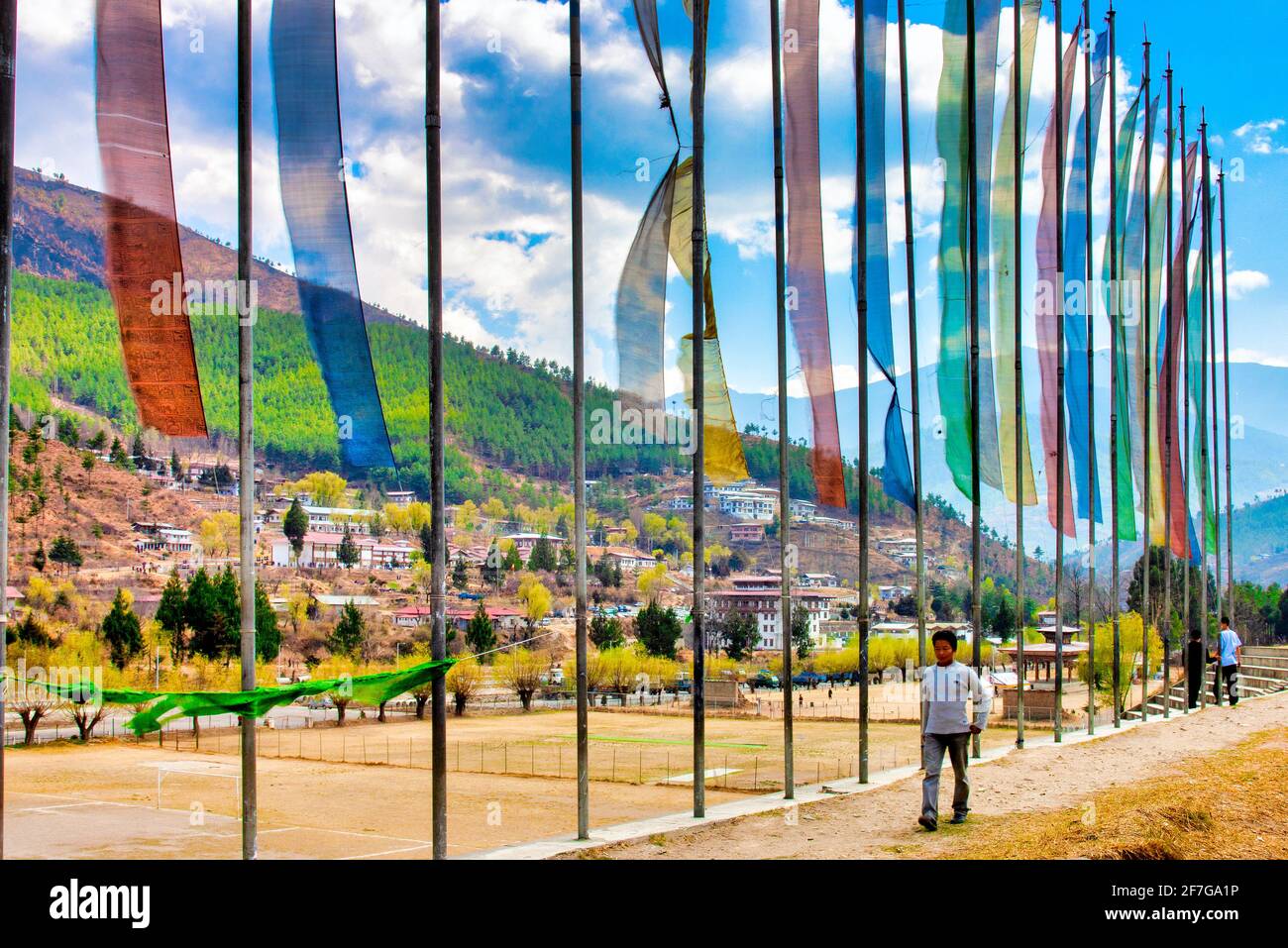 Prayer flags near a sports field in Thimphu, Bhutan Stock Photo