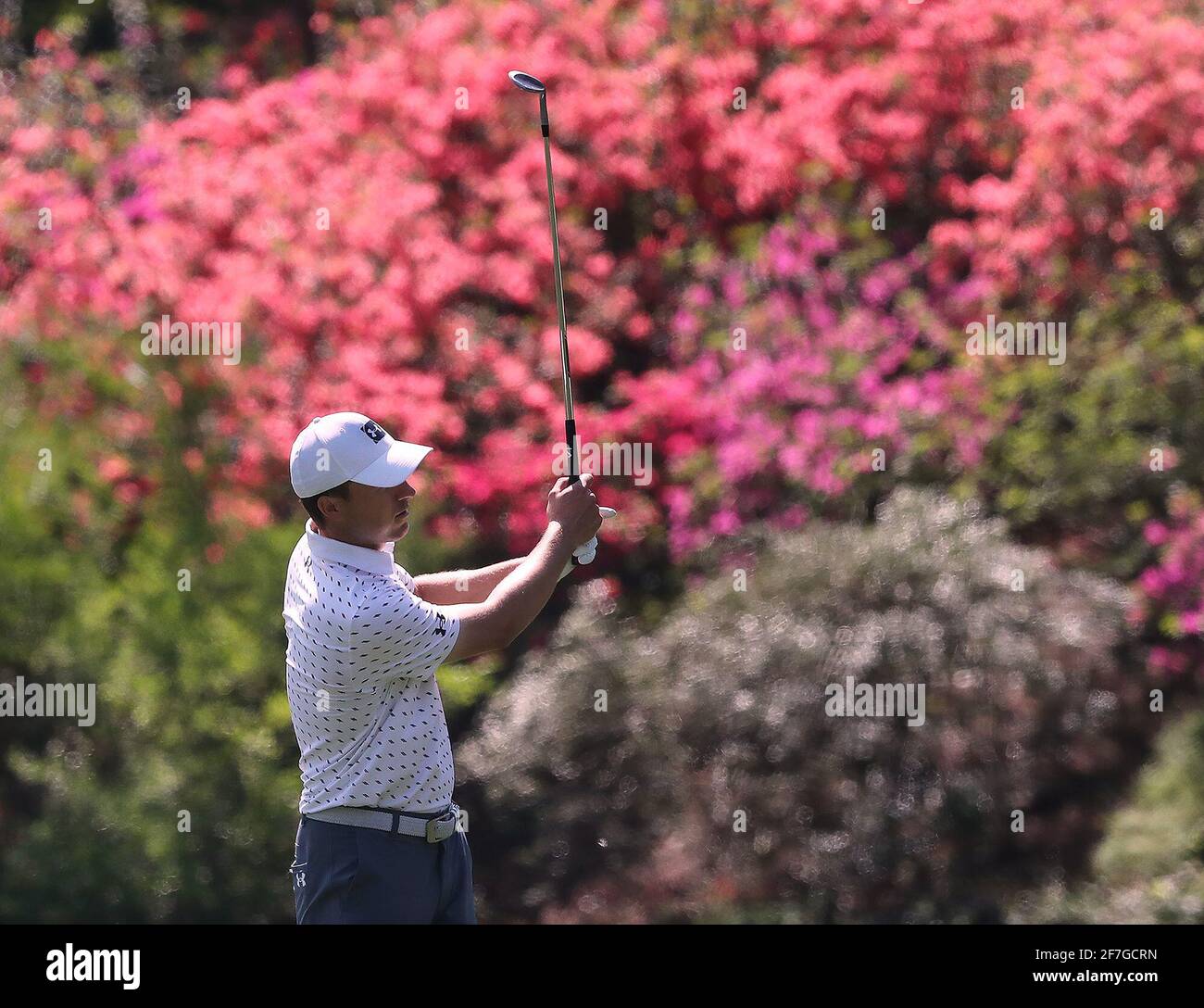 Augusta, USA. 06th Apr, 2021. The azaleas are beginning to pop as Jordan Spieth chips to the 13th green during his practice round for the Masters at Augusta National Golf Club on Tuesday, April 6, 2021, in Augusta, Georgia. (Photo by Curtis Compton/Atlanta Journal-Constitution/TNS/Sipa USA) Credit: Sipa USA/Alamy Live News Stock Photo