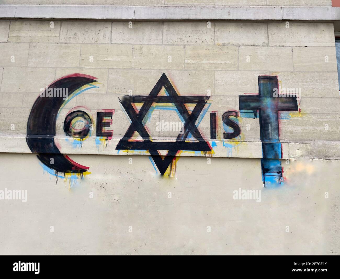 Religious Harmony - The word Coexist written with signs of muslims, jews and christians Stock Photo