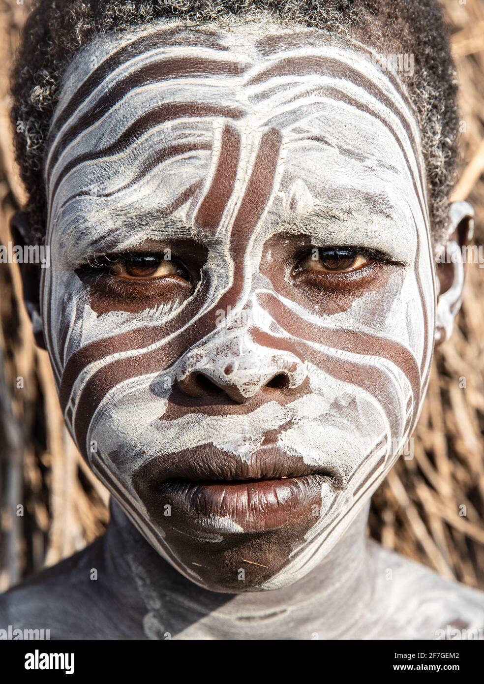 Decorative patterns are created using the white clay paint. It's possible this is attractive to lucrative visiting tourists. OMO VALLEY, ETHIOPIA: MEE Stock Photo