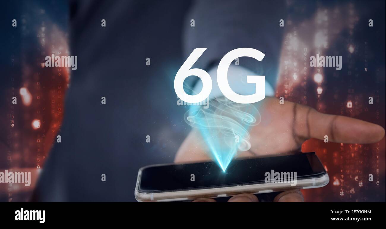 Composition of the word 6g over a man holding a smartphone in background Stock Photo