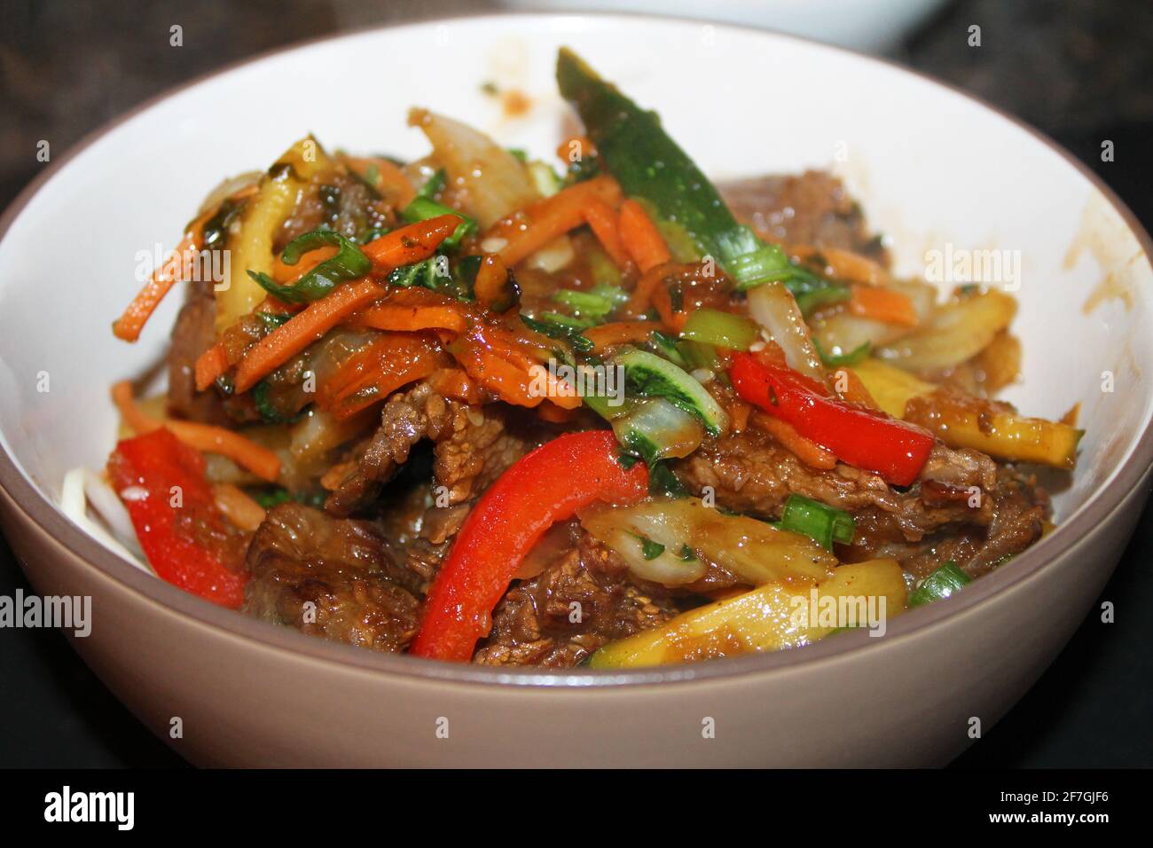 A close-up of the Korean beef stir-fry, Bulgogi, in a bowl. Stock Photo
