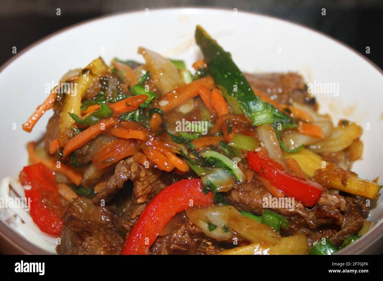 A close-up of the Korean beef stir-fry, Bulgogi, in a bowl. Stock Photo