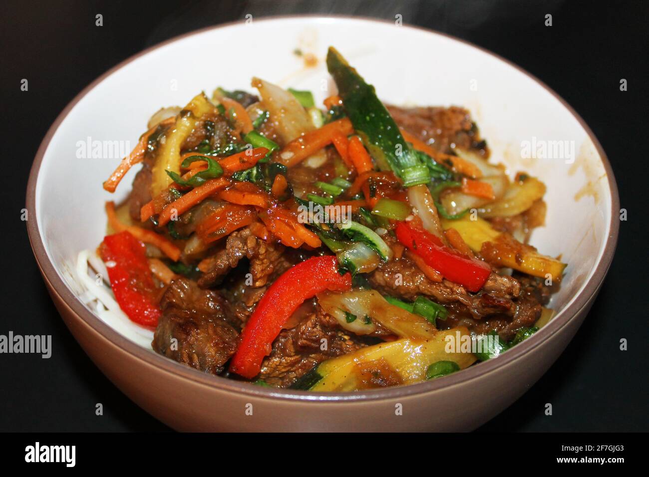 A close-up of the Korean beef stir-fry, Bulgogi, in a bowl. Stock Photo