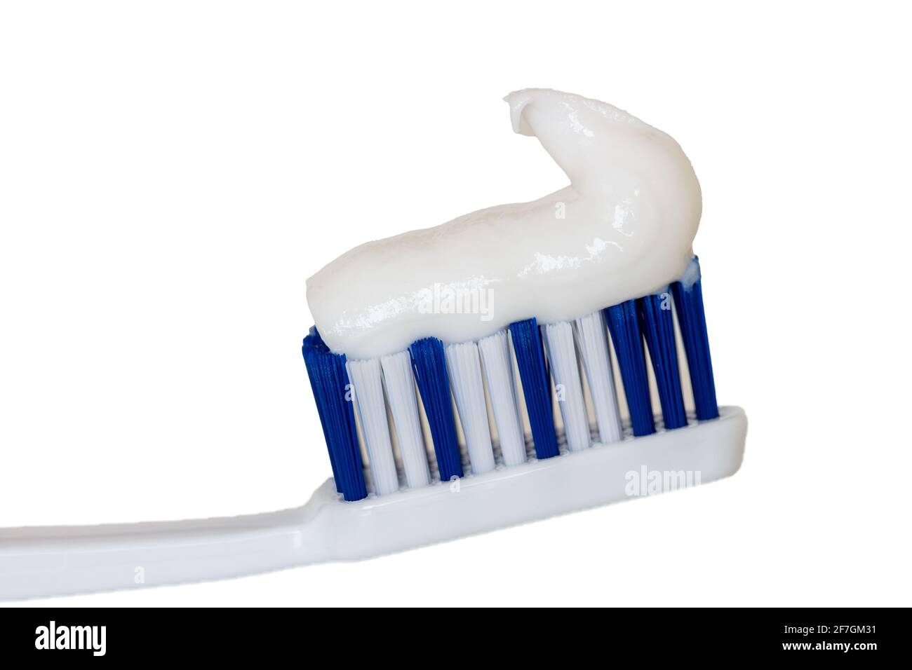 A toothbrush with toothpaste on white background Stock Photo - Alamy