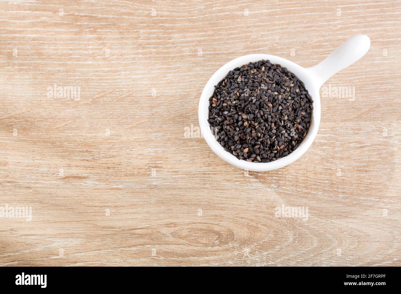 Black organic seeds of sesame - Sesamum indicum. Top view Stock Photo ...