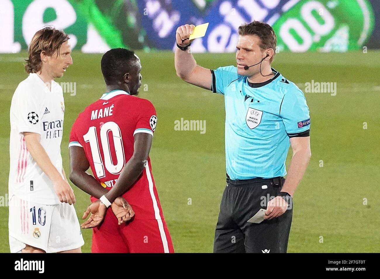 German referee Felix Brych shows yellow card to Liverpool FCs Sadio Mane during UEFA Champions League Quarter-finals 1st leg match