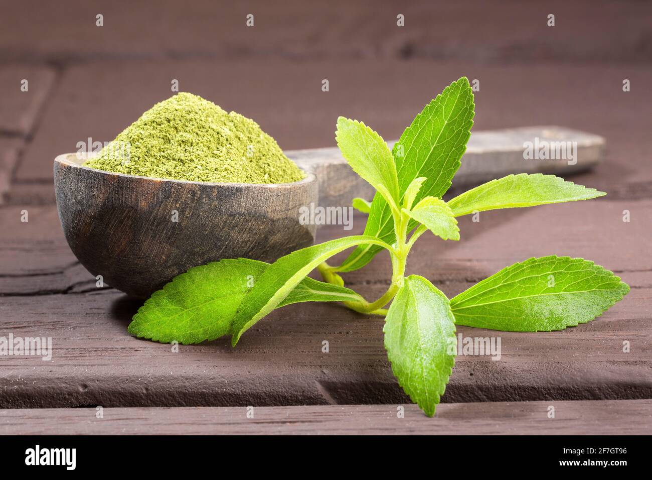 Natural sweetener powder from stevia plant - Stevia rebaudiana. Wooden background Photo - Alamy