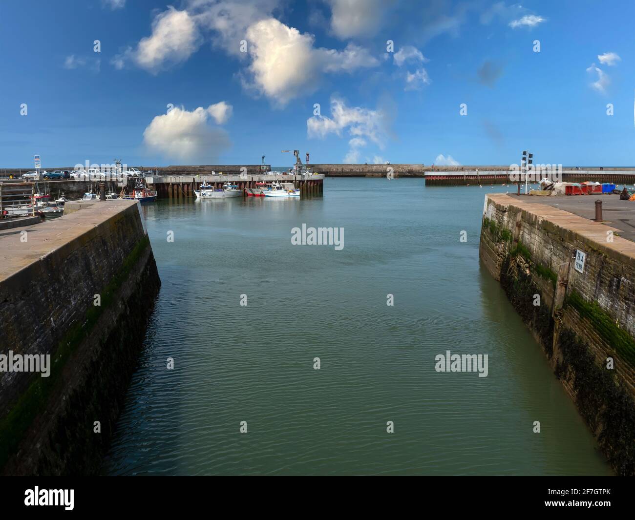 Port-en-Bessin-Huppain, France, March 2021. Picture made of sailing channel towards the sea in a picturesque small town in Normandy Stock Photo
