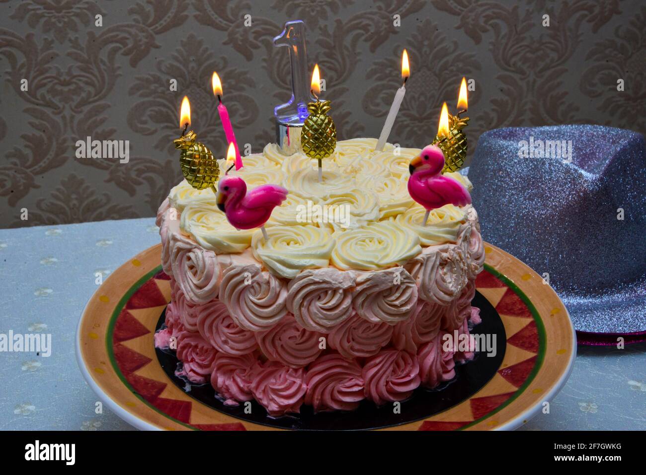 Birthday cake decorated with pineapple. Decorate with candles. And one number is an indication of age Stock Photo
