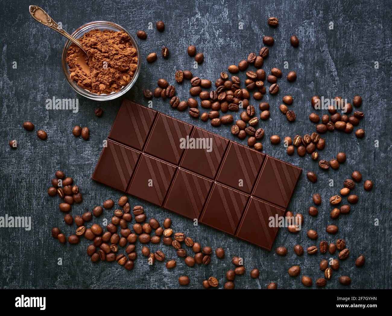 Chocolate bar, cocoa powder and fresh fried coffee beans, top view