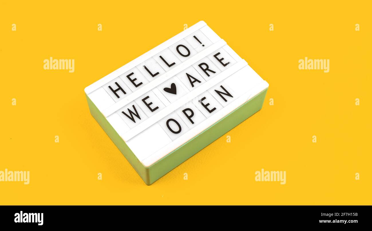 Hello we are open text sign flat lay background, concept and top view photo Stock Photo Alamy