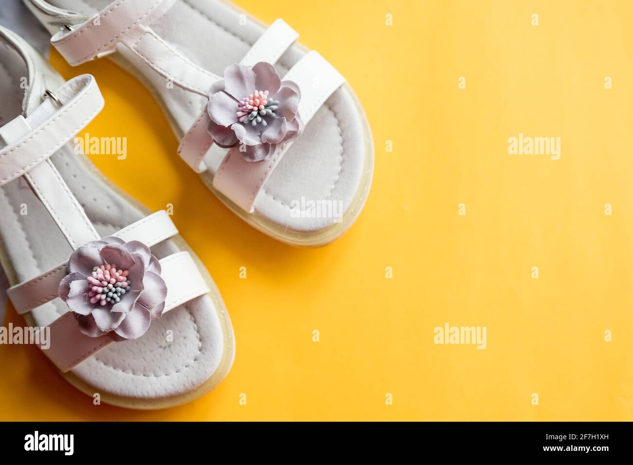 Baby girl pink sandals on white background. Baby fashion pair pink