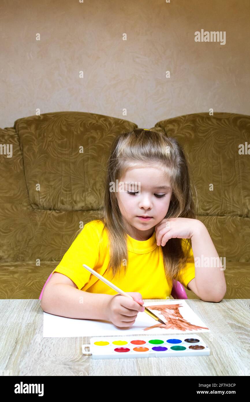 Glass and ceramic bowls with wheat flour, a glass and a jug of water