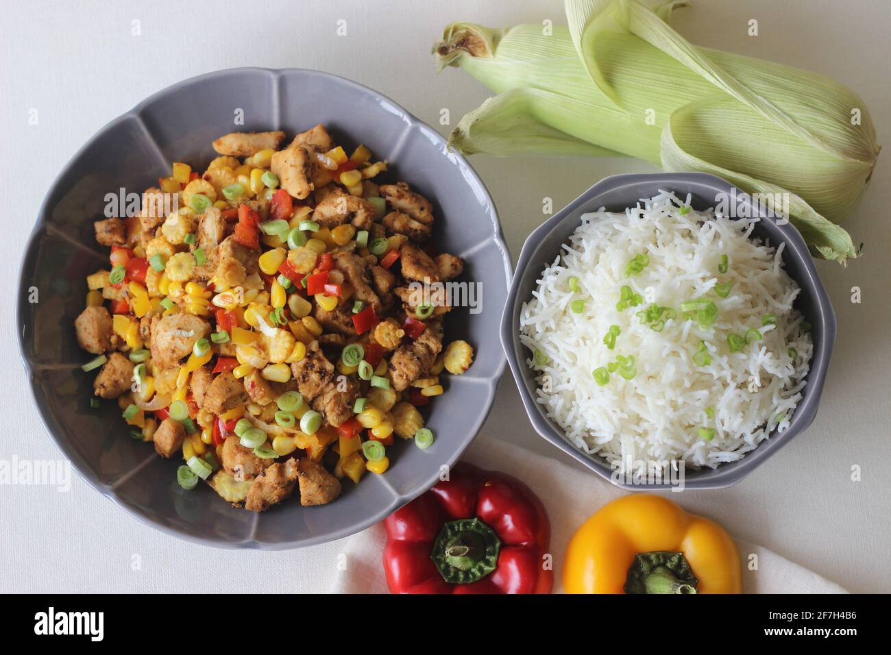 Steamed white rice served with sorted chicken, sweet corn, baby corn ...