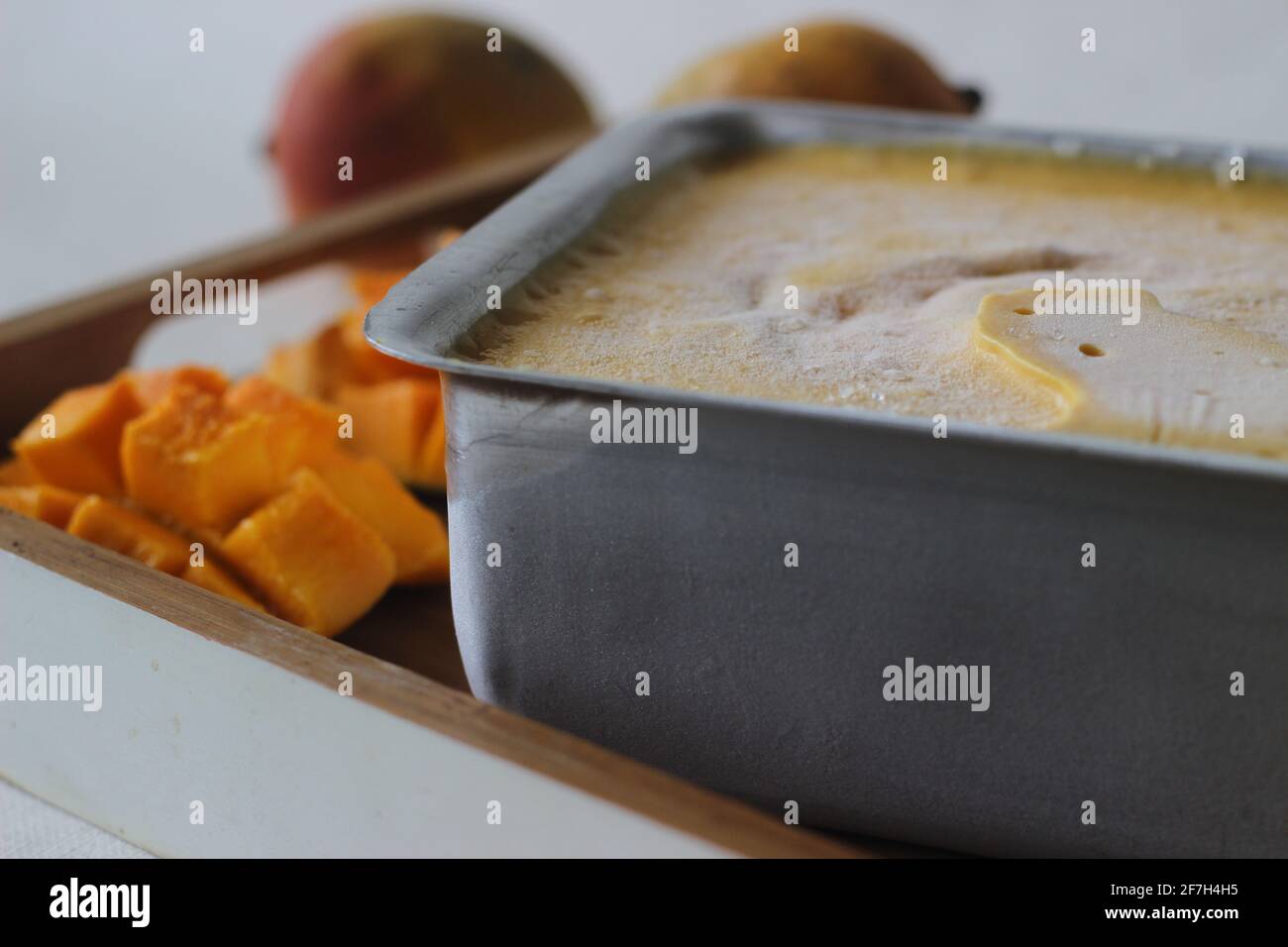 https://c8.alamy.com/comp/2F7H4H5/home-made-mango-ice-cream-prepared-using-lalbagh-mangoes-kept-outside-from-freezer-in-an-aluminium-tray-a-treat-in-the-summer-heat-2F7H4H5.jpg