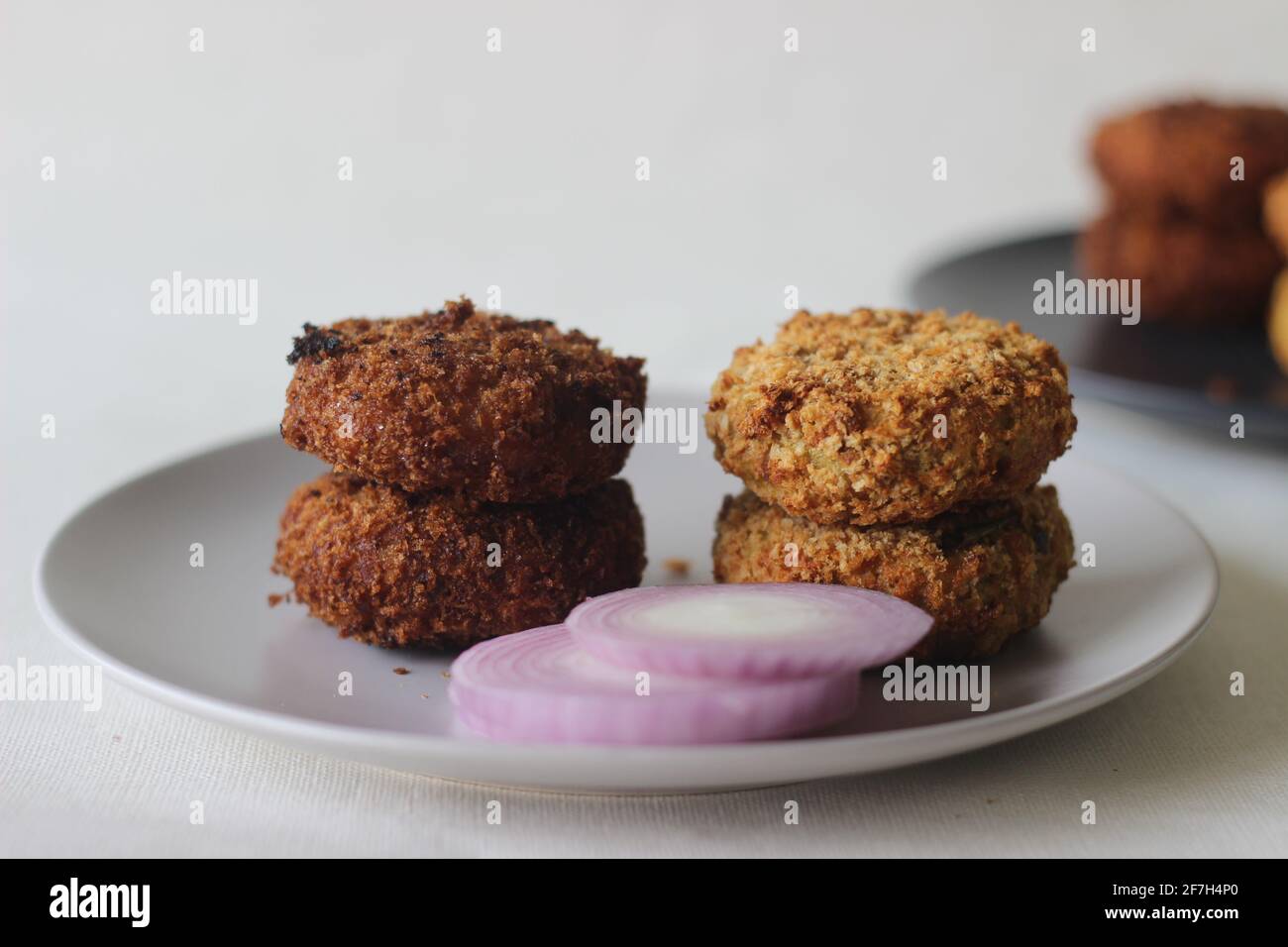 deep fried chicken cutlet on the right side and air fried chicken