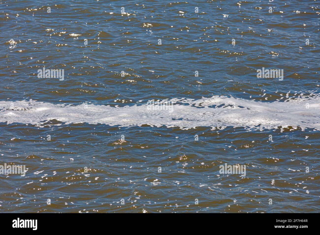 Abstract image of a foam stripe on a river during a wind storm in Steveston British Columbia Canada Stock Photo