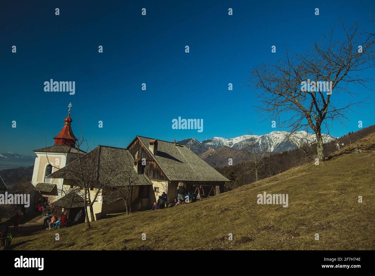 Panorama of a church on Sveti Primoz, a well known hiking spot in Karavanke alps, just above Kamnik, Slovenia. Stock Photo