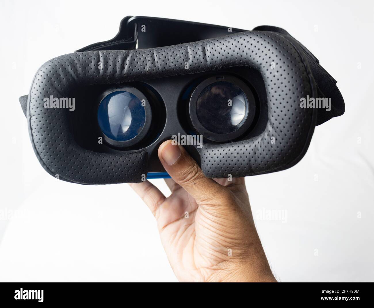 a hand looking into a vr goggles,an introduction of using a vr headset, for  360 and interactive video and stuff Stock Photo - Alamy