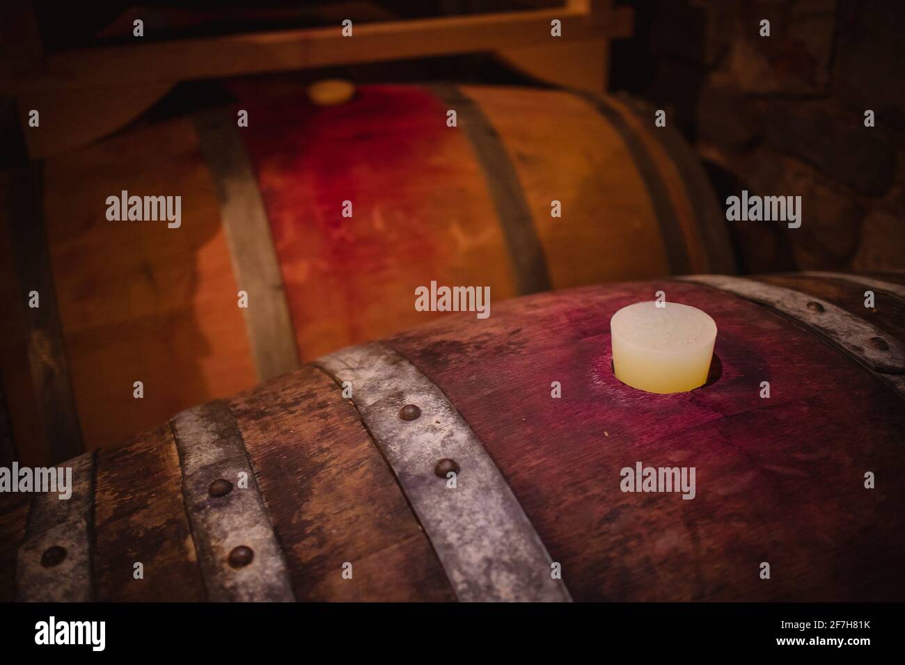 Plastic plug in red wine barrels. Top of the wine barrel in a wine